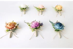 Detailed set of six artificial silk rose boutonnieres in assorted colors for weddings