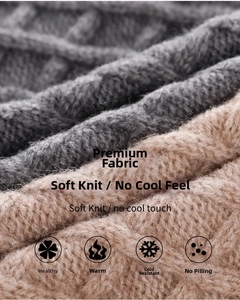 Close-up of thick grey and beige knit fabric showing soft warm texture and weave