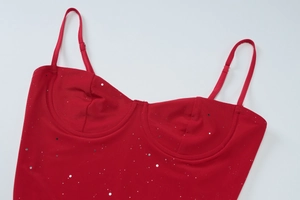 Detail of red sequined camisole dress with underwire cups and thin shoulder straps