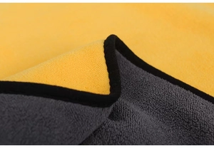 Macro shot of high-density microfiber pet towel with yellow and grey thick coral fleece