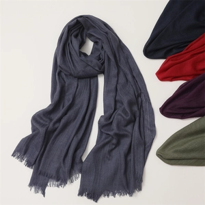 Detailed view of grey linen cotton scarf with frayed fringes and color options
