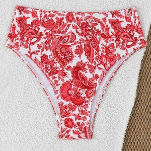 Detail of red paisley high waisted bikini bottom with premium stitching and floral print