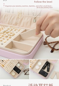 Pink jewelry box detail showing adjustable earring plate and soft velvet lining