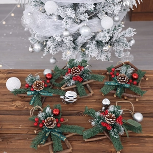 Set of 5 rustic star Christmas wreaths with pine needles and red berries on wooden desk