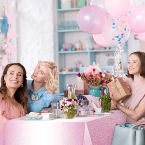 Close-up of sparkling pink and purple dot tablecloth for girls' birthday party decor