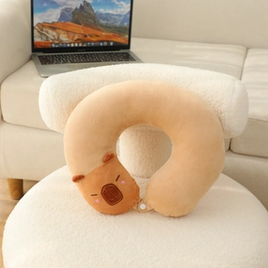 Detailed plush capybara U-shaped neck pillow with snap button and embroidery