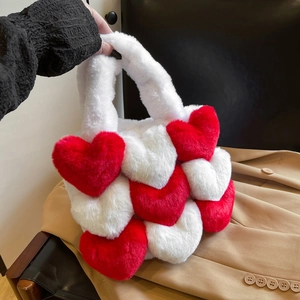 Detail shot of the plush red and white heart patchwork fabric on this stylish tote bag