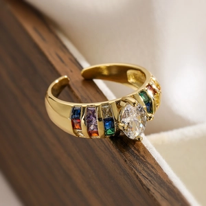 Detailed macro view of 18K gold plated ring with marquise and colorful square gemstones