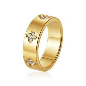 Macro view of 18K gold plated clover ring with white zircon inlays and polished finish