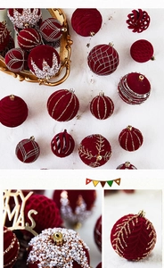 Detail of burgundy flocked Christmas ornaments with pearls and gold glitter accents
