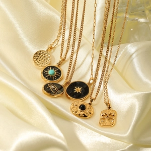 Golden necklaces with hexagon star turquoise pendant and sun medallion on silk
