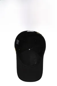 Detailed interior view of a black baseball cap showing reinforced seams and fabric tags