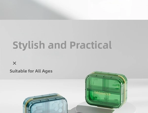 Detail of 4-compartment portable pill organizer with golden latch and clear shell
