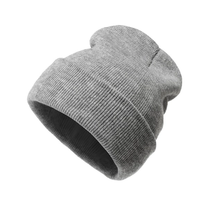 Detailed view of the rib-knit texture and soft gray fabric of this winter beanie hat