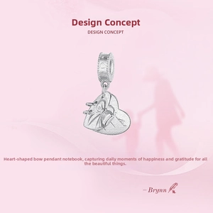 Detailed macro view of S925 sterling silver heart charm with bowknot and notebook textures