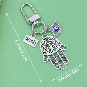 Blue Evil Eye Hamsa Hand metal keychain with silver wish charm and crystal detail