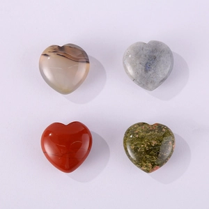 Detailed view of four heart-shaped natural gemstones in agate, labradorite, jasper and epidote