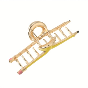 Whimsical metal hair claw clip in pencil shape with colorful enamel accents on white background