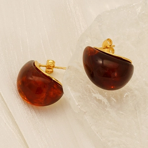 Elegant amber resin dome stud earrings with 18K gold plated titanium base and silk texture