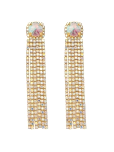 Macro view of long tassel earrings with sparkling rhinestones and colorful gemstone