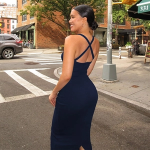 Detailed back view of a navy blue slim fit maxi dress featuring a cross halter back design