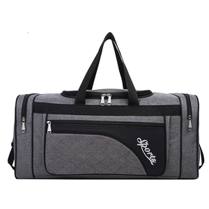 Grey sports gym bag with quilted diamond pattern and large travel capacity design