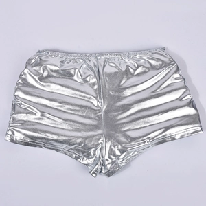 Detail of silver metallic insulated shorts featuring glossy finish and elastic waist