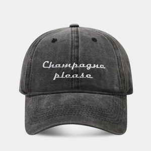 Retro washed charcoal baseball cap featuring Champagne please white cursive embroidery