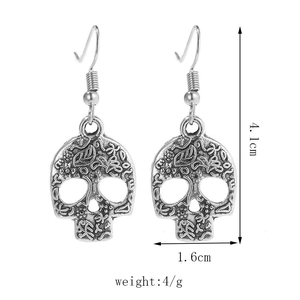 Detailed dimensions of silver skull earrings with floral carvings and hook design