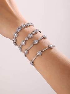 Macro shot of silver crystal zircon bracelets set showing layered handmade craftsmanship