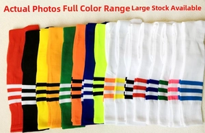 Detailed flat lay of colorful striped knee-high football socks in various vibrant colors