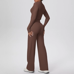 Rear view of brown high-waist wide-leg yoga pants and cropped long-sleeve sports top