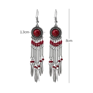 Ethnic red tassel earrings with tribal details and dimensions 8cm in length