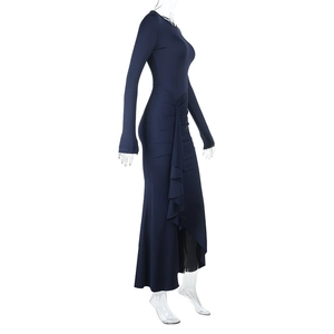 Detail of navy blue slim fit long sleeve dress featuring side ruched pleated texture