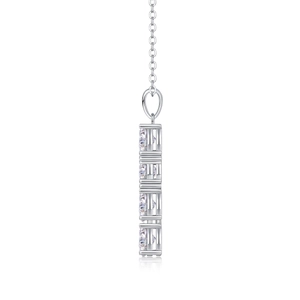 Macro side view of silver cross pendant with four vertically set clear gemstones