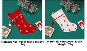 Detail of red and white non-woven Christmas stockings with festive tree patterns