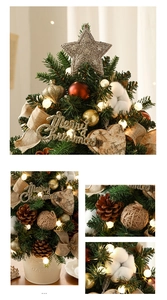 Macro detail of decorated tabletop Christmas tree with warm LED lights and pine cones