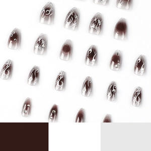 Short brown gradient stiletto press-on nails with white vine patterns and rhinestones