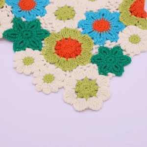 Handmade crochet daisy pattern headscarf with vibrant floral knit design in various colors
