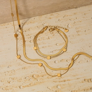 Ensemble collier et bracelet double couche en maille serpent dorée au style minimaliste