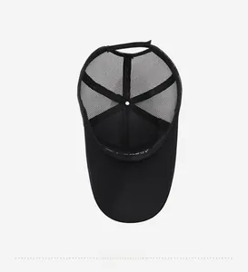 Detail view of the breathable mesh back and inner embroidered band of the black baseball cap