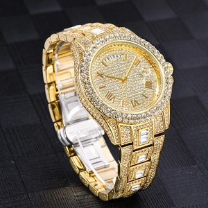 Detailed view of luxury gold watch dial featuring diamond encrusting and Friday day display