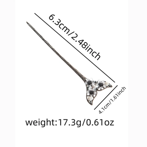Detail of bronze hairpin with black and white flower petals and pearl center