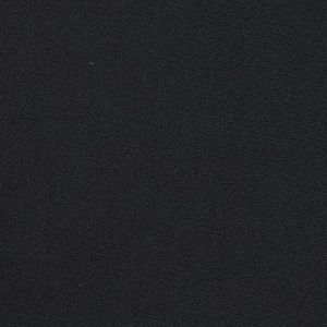 Macro detail of high-density black lace fabric texture on a mini party dress