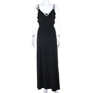 Close-up of black spaghetti strap evening dress featuring ruffled neckline detail