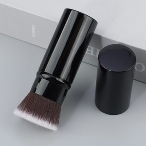 Detail of retractable flat top foundation brush with dense dual-tone soft synthetic bristles