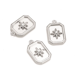 Detail of three stainless steel rectangular star pendants with clear zircon stones