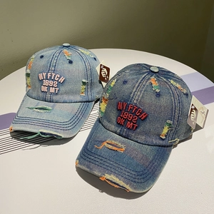 Vintage embroidered denim baseball caps in light and dark blue with distressed details