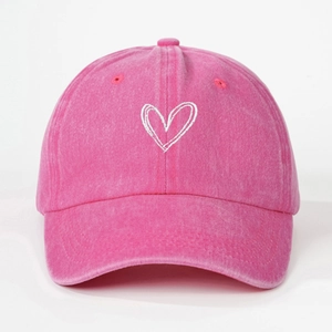 Close-up of heart embroidery on washed cotton kids baseball cap in rose pink