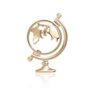 Polished gold globe brooch with hollow continental design on a clean white background